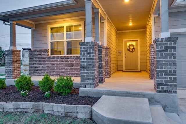 98 Barton Creek Ln, Hutto, TX 78634 - property entrance featuring covered porch and brick siding