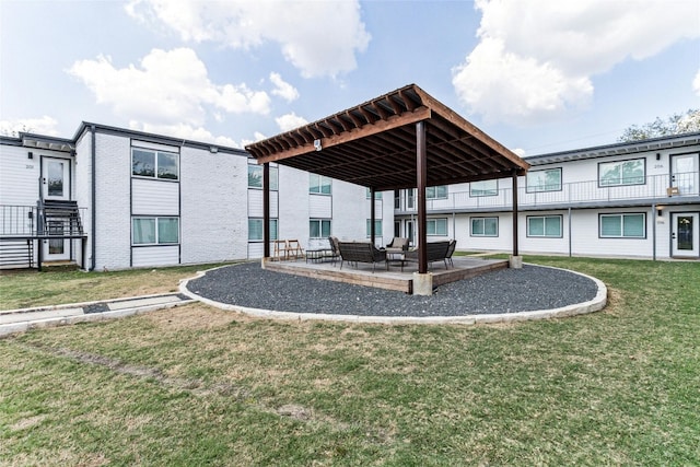 1200 E 52nd St Unit 105, Austin, TX 78723 - back of property with outdoor lounge area, a yard, and a patio area