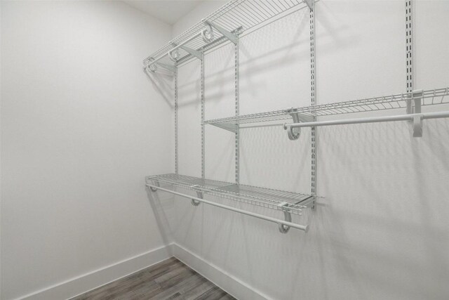 1200 E 52nd St Unit 105, Austin, TX 78723 - walk in closet featuring wood finished floors