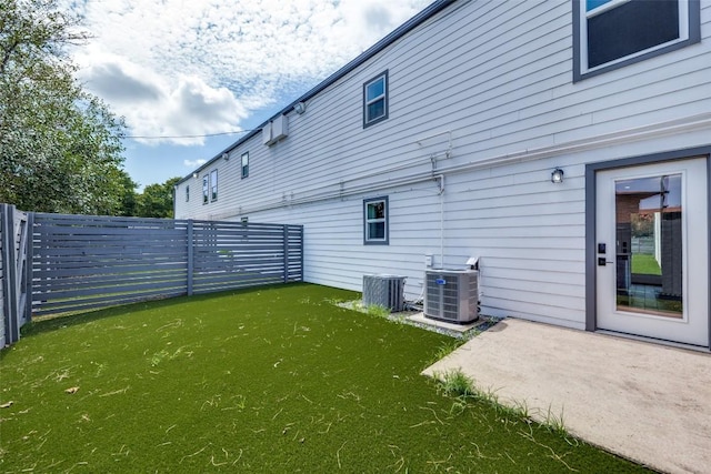 1200 E 52nd St Unit 105, Austin, TX 78723 - view of yard with central air condition unit and a patio