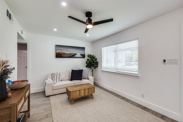 1200 E 52nd St Unit 105, Austin, TX 78723 - living room featuring ceiling fan, baseboards, light wood-style floors, and recessed lighting