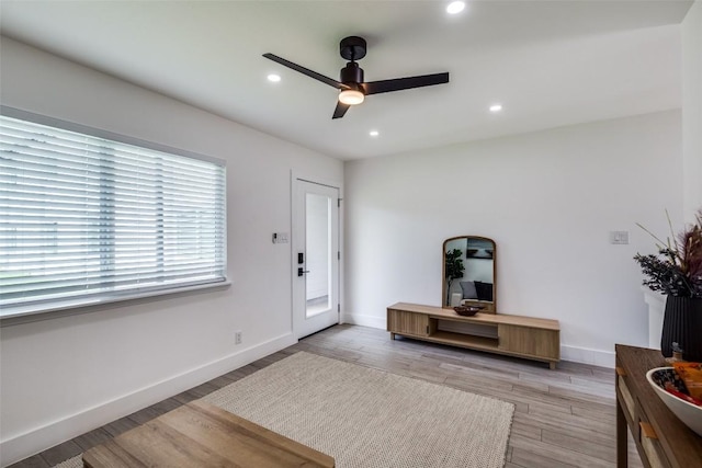 1200 E 52nd St Unit 105, Austin, TX 78723 - foyer entrance with a ceiling fan, light wood-style floors, baseboards, and recessed lighting