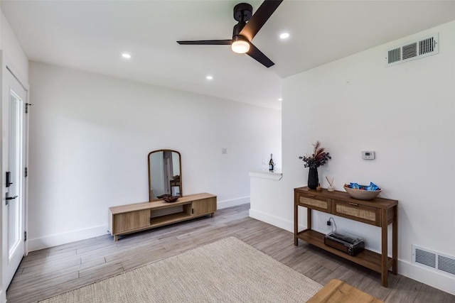 1200 E 52nd St Unit 105, Austin, TX 78723 - living room with a ceiling fan, wood finished floors, recessed lighting, and baseboards