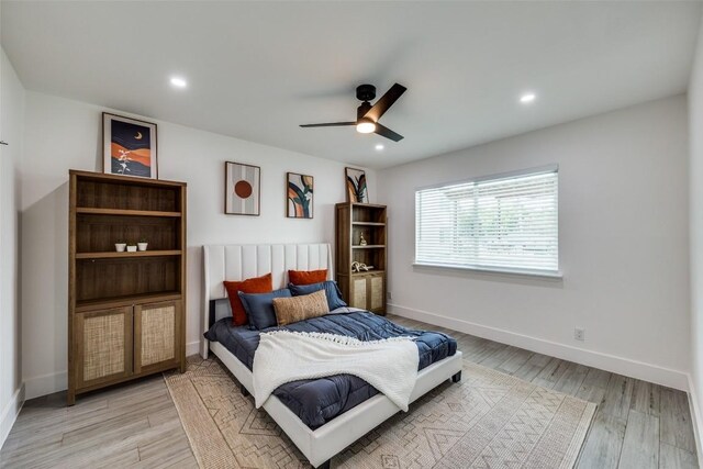 1200 E 52nd St Unit 105, Austin, TX 78723 - bedroom featuring light wood-type flooring, baseboards, recessed lighting, and ceiling fan