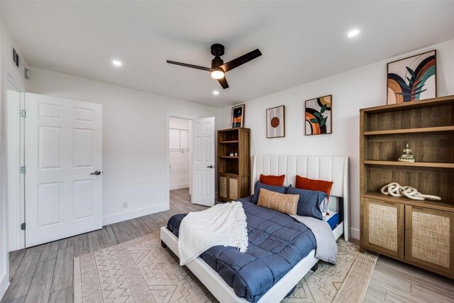 1200 E 52nd St Unit 105, Austin, TX 78723 - bedroom with light wood-style floors, recessed lighting, a ceiling fan, and baseboards