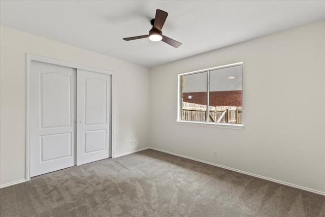 404 N Belinda Ct, Bastrop, TX 78602 - unfurnished bedroom featuring carpet, a closet, ceiling fan, and baseboards