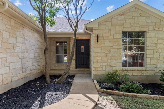 404 N Belinda Ct, Bastrop, TX 78602 - entrance to property with stone siding and roof with shingles