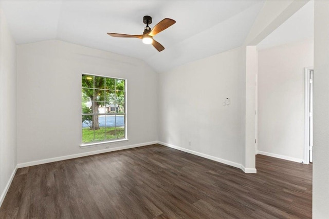 404 N Belinda Ct, Bastrop, TX 78602 - unfurnished room with vaulted ceiling, dark wood-type flooring, ceiling fan, and baseboards