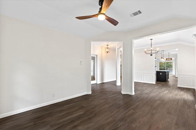 404 N Belinda Ct, Bastrop, TX 78602 - unfurnished living room with vaulted ceiling, dark wood finished floors, a chandelier, and a ceiling fan