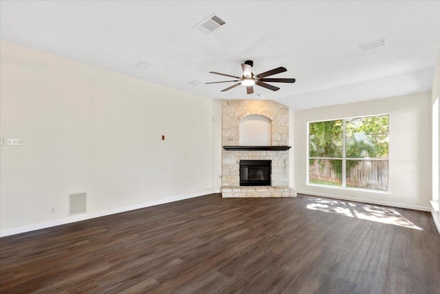 404 N Belinda Ct, Bastrop, TX 78602 - unfurnished living room featuring dark wood-style floors, a ceiling fan, a fireplace, and baseboards