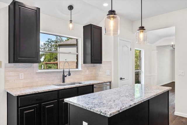 404 N Belinda Ct, Bastrop, TX 78602 - kitchen with a sink, stainless steel dishwasher, tasteful backsplash, dark wood-style floors, and lofted ceiling