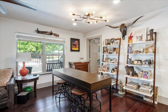 5701 Ave G, Austin, TX 78752 - dining space with dark wood-type flooring and a chandelier