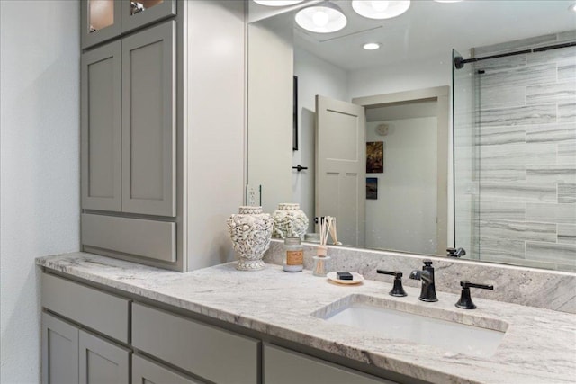 5701 Ave G, Austin, TX 78752 - bathroom featuring double vanity and a shower