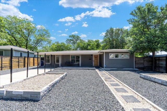 5701 Ave G, Austin, TX 78752 - view of front of house with a fenced backyard and covered porch