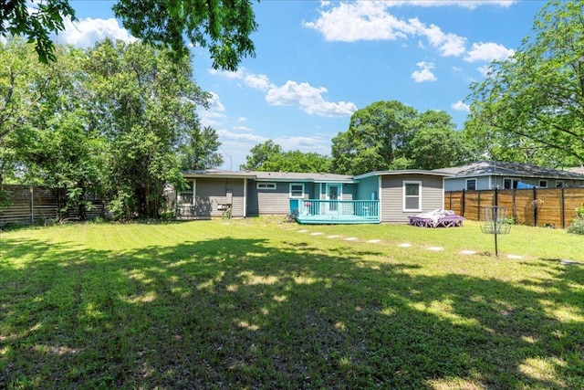 5701 Ave G, Austin, TX 78752 - back of house featuring a deck and a fenced backyard