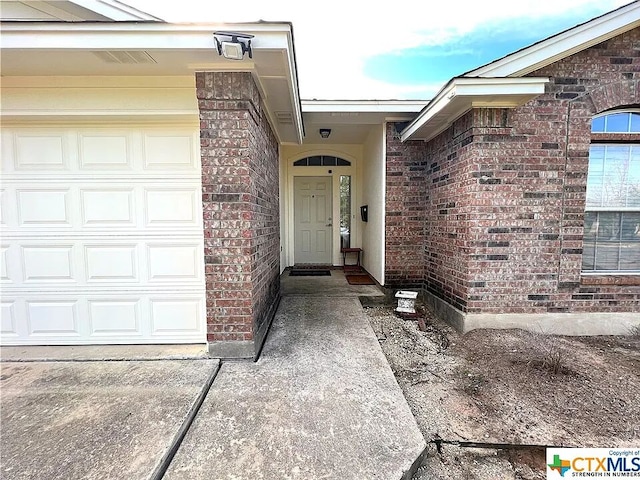 1119 Burgess Dr, Leander, TX 78641 - property entrance featuring brick siding