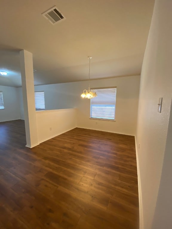 1119 Burgess Dr, Leander, TX 78641 - unfurnished dining area with dark wood finished floors and a chandelier