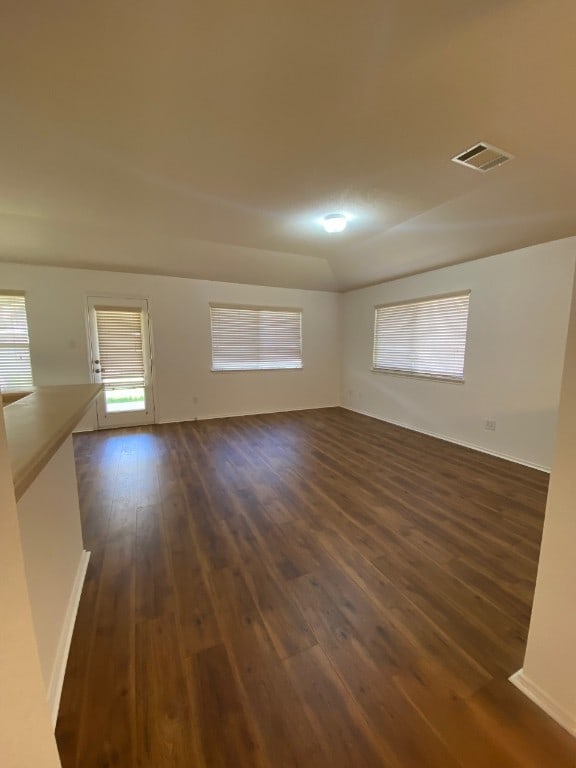 1119 Burgess Dr, Leander, TX 78641 - spare room featuring dark wood-type flooring and baseboards