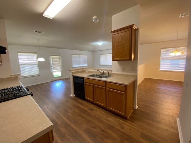1119 Burgess Dr, Leander, TX 78641 - kitchen featuring black dishwasher, brown cabinets, and dark wood-type flooring
