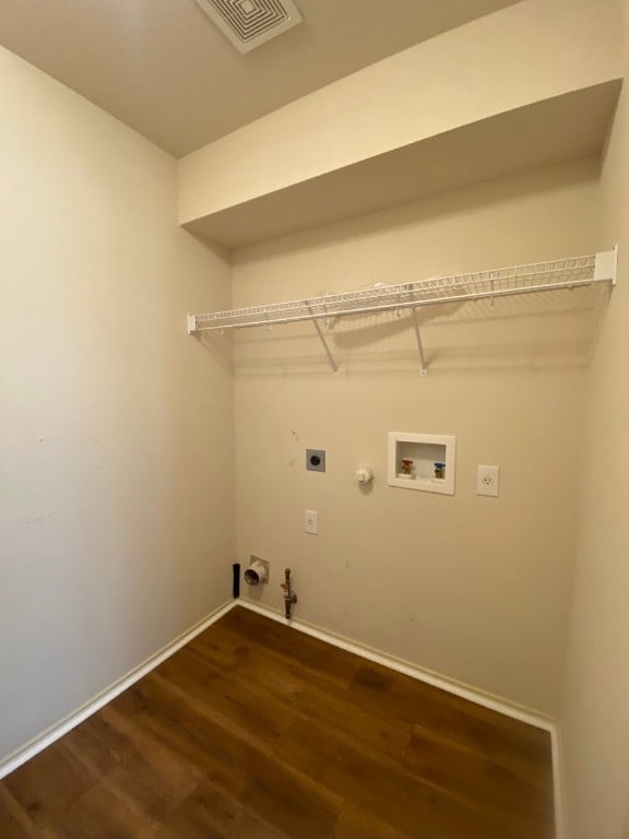 1119 Burgess Dr, Leander, TX 78641 - laundry area with gas dryer hookup, hookup for an electric dryer, wood finished floors, and washer hookup