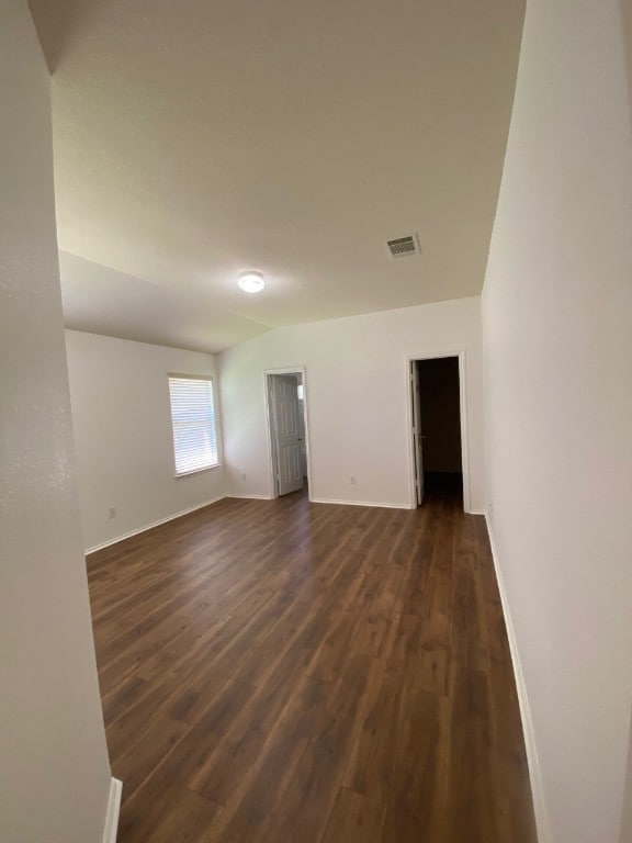 1119 Burgess Dr, Leander, TX 78641 - unfurnished room with dark wood-style floors and baseboards