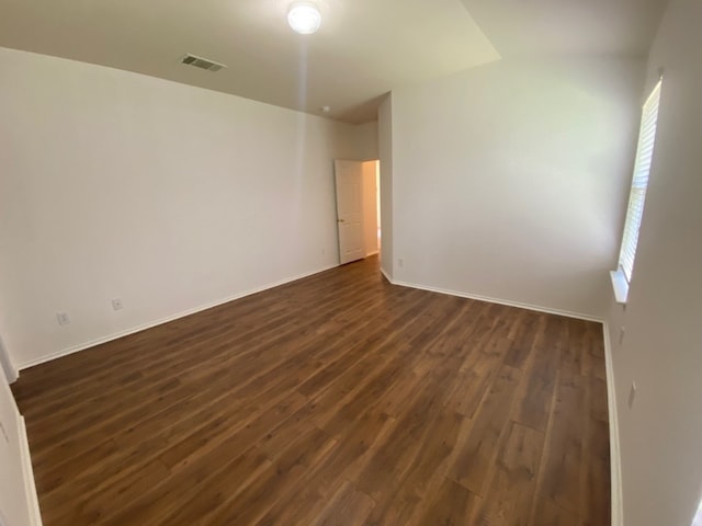 1119 Burgess Dr, Leander, TX 78641 - spare room with dark wood-style flooring and healthy amount of natural light