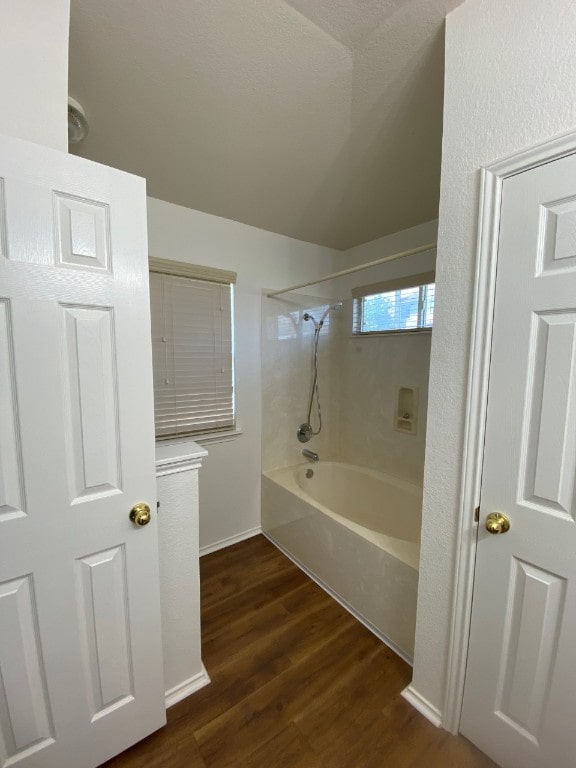 1119 Burgess Dr, Leander, TX 78641 - full bathroom with wood finished floors and shower / bath combination