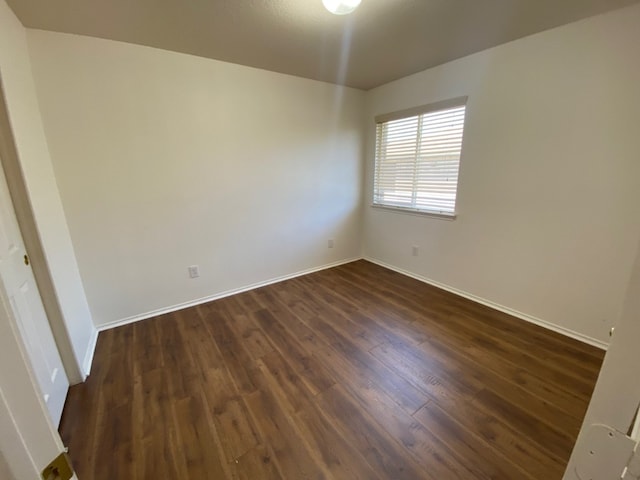 1119 Burgess Dr, Leander, TX 78641 - unfurnished room with dark wood-type flooring and baseboards