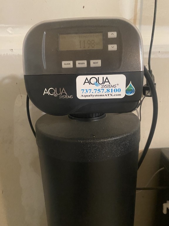 1119 Burgess Dr, Leander, TX 78641 - detailed view of a water softener