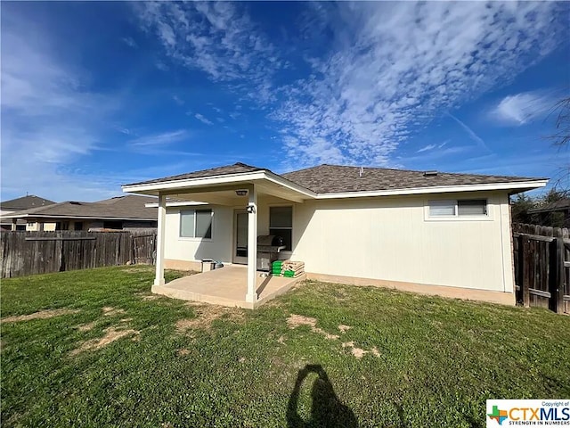 1119 Burgess Dr, Leander, TX 78641 - rear view of property featuring a patio and a fenced backyard