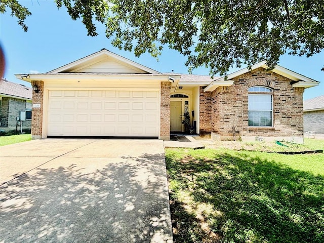 1119 Burgess Dr, Leander, TX 78641 - single story home featuring concrete driveway, a garage, brick siding, and a front yard
