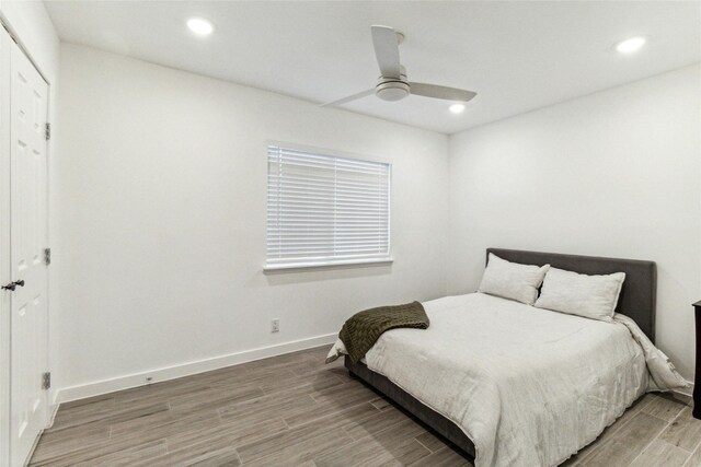 1200 E 52nd St Unit 101, Austin, TX 78723 - bedroom featuring light wood-type flooring, recessed lighting, baseboards, and a ceiling fan