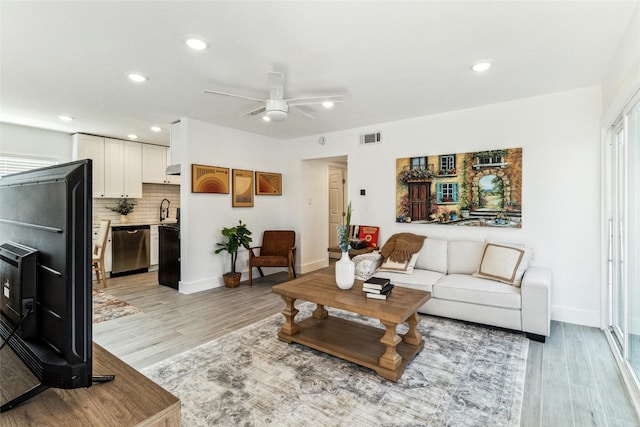 1200 E 52nd St Unit 101, Austin, TX 78723 - living area with ceiling fan, light wood-style floors, recessed lighting, and baseboards