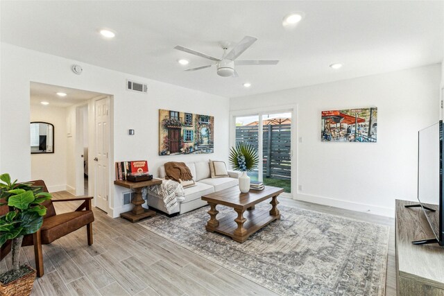 1200 E 52nd St Unit 101, Austin, TX 78723 - living area with a ceiling fan, recessed lighting, light wood-style flooring, and baseboards