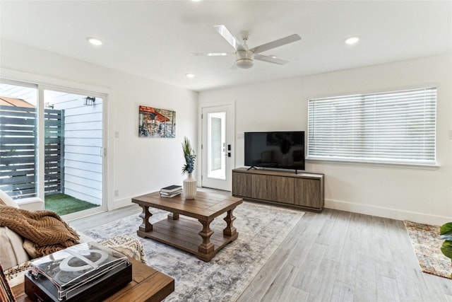 1200 E 52nd St Unit 101, Austin, TX 78723 - living room featuring healthy amount of natural light, wood finished floors, ceiling fan, and recessed lighting