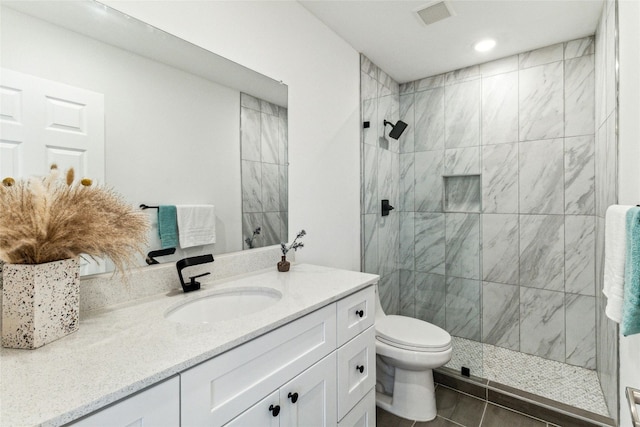 1200 E 52nd St Unit 101, Austin, TX 78723 - bathroom with vanity, a walk in shower, toilet, recessed lighting, and tile patterned flooring