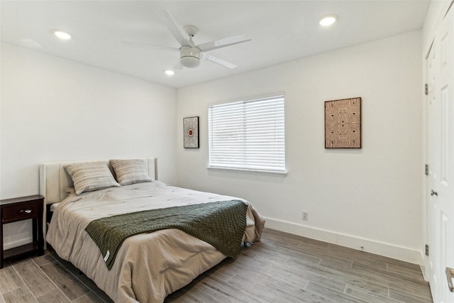 1200 E 52nd St Unit 101, Austin, TX 78723 - bedroom featuring light wood-style floors, baseboards, recessed lighting, and a ceiling fan