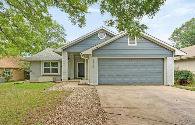 2405 Monarch Dr, Austin, TX 78748 - ranch-style house featuring driveway, an attached garage, a front lawn, and brick siding