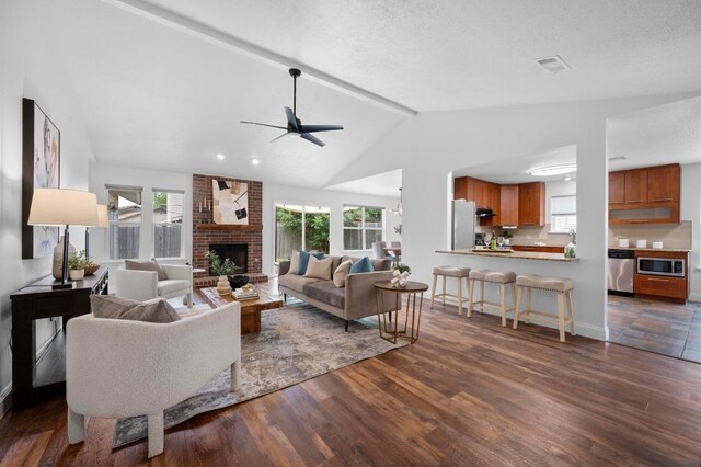 2405 Monarch Dr, Austin, TX 78748 - living area featuring ceiling fan, a brick fireplace, and dark wood-type flooring
