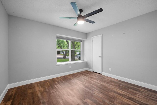 2405 Monarch Dr, Austin, TX 78748 - spare room featuring wood finished floors, a ceiling fan, baseboards, and a textured ceiling