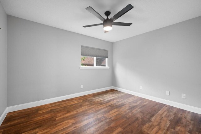 2405 Monarch Dr, Austin, TX 78748 - empty room with wood finished floors, baseboards, and ceiling fan