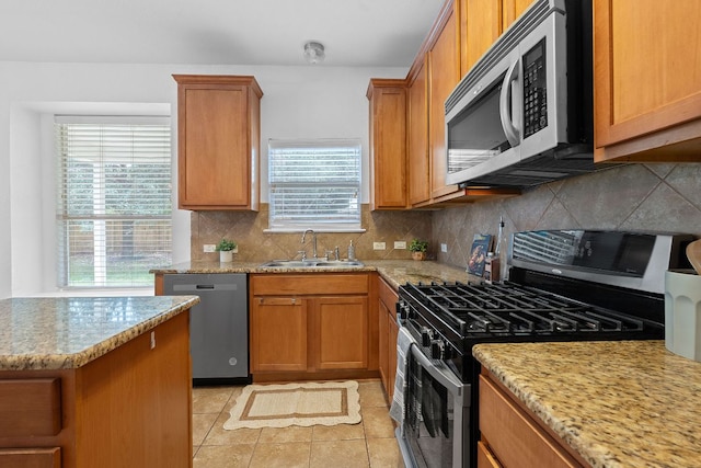14404 Showdown Ln, Austin, TX 78717 - kitchen featuring stainless steel appliances, a sink, plenty of natural light, and light tile patterned floors