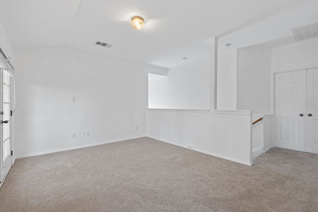 14404 Showdown Ln, Austin, TX 78717 - carpeted empty room featuring vaulted ceiling and baseboards
