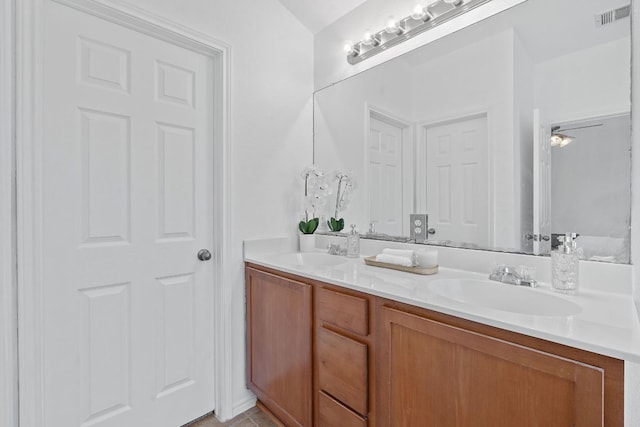 14404 Showdown Ln, Austin, TX 78717 - bathroom featuring double vanity and tile patterned floors