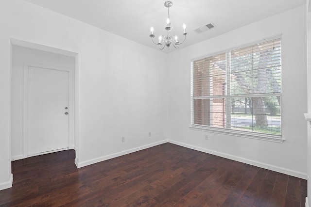 14404 Showdown Ln, Austin, TX 78717 - empty room featuring a chandelier, dark wood finished floors, and baseboards