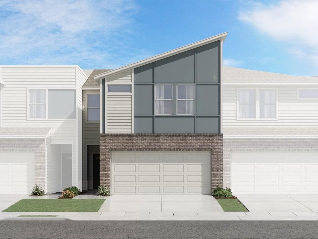 1850 Settlers Glen Dr Unit 1403, Round Rock, TX 78665 - townhome / multi-family property with brick siding, a garage, and driveway