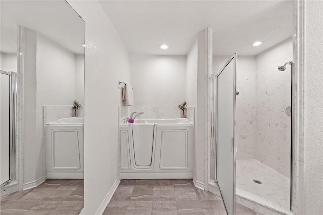 11105 Highview Dr, Belton, TX 76513 - bathroom featuring a garden tub, a stall shower, baseboards, and recessed lighting