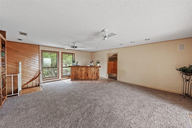 11105 Highview Dr, Belton, TX 76513 - unfurnished living room with carpet flooring, a textured ceiling, ceiling fan, and baseboards