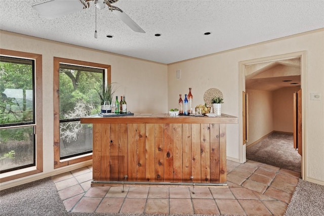 11105 Highview Dr, Belton, TX 76513 - kitchen with a textured ceiling, ceiling fan, and light tile patterned floors