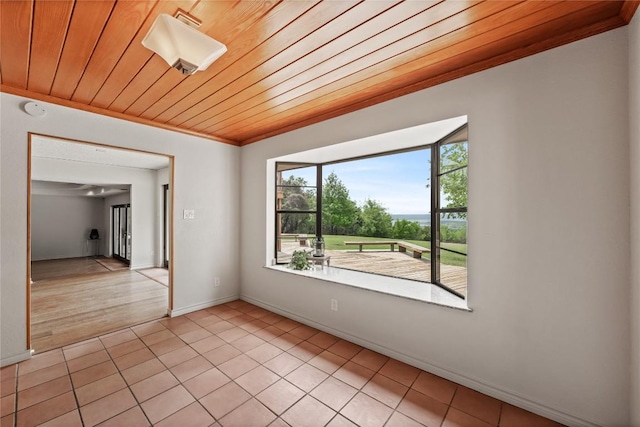 11105 Highview Dr, Belton, TX 76513 - spare room featuring wood ceiling, ornamental molding, light tile patterned floors, and baseboards